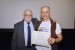 Dr. Nagib Callaos, General Chair, giving Dr. Anton Kolonin an award certificate in appreciation for his presentation oriented to inter-disciplinary communication entitled: "Reputation Systems for Collective Intelligence."